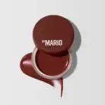 Makeup by Mario Jelly Jar Lip & Cheek Balm in a rich, warm brown shade with a product swatch against a neutral background.